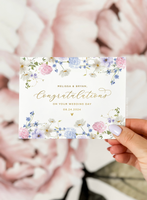 A beautifully designed custom wedding day card featuring elegant floral illustrations and personalized details, perfect for celebrating the newlyweds.