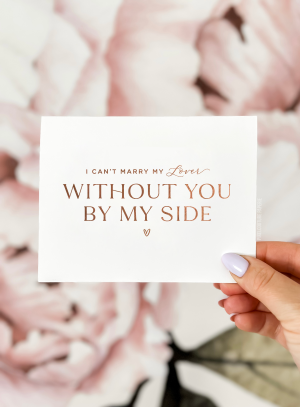 Bridesmaid proposal card that reads "I can't marry my lover without you by my side" in elegant script on white cardstock, styled for a romantic wedding theme.